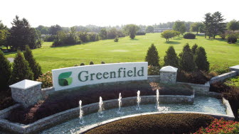 Greenfield monument sign with fountain.